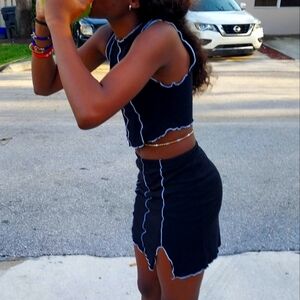 Black and white striped mini skirt and crop top, Just Polly New York.